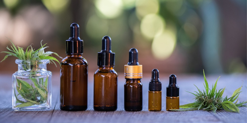 tiny bottles of cbd oil with dropper